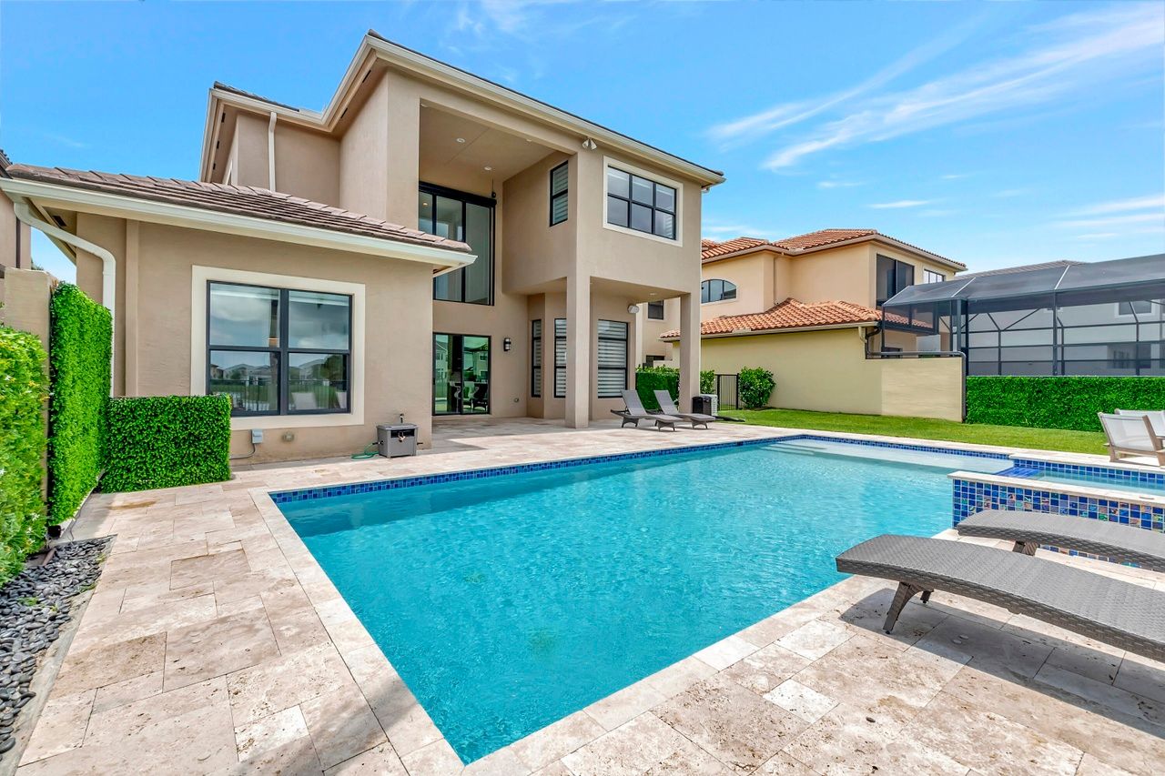Professional painter in Melbourne, FL applying fresh coat to home exterior